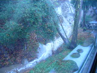 Rushing rainwater in creek outside bedroom windows 2